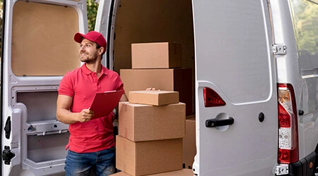 Expert packing and moving executive handling household goods for safe transportation